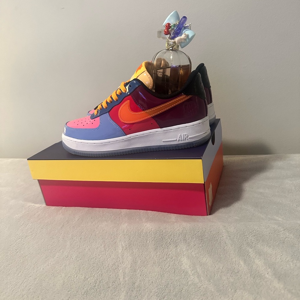 Nike multiple color air forces with orange and tan shoe laces